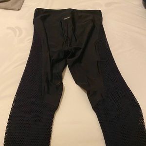 Koral mid rise fishnet leggings.